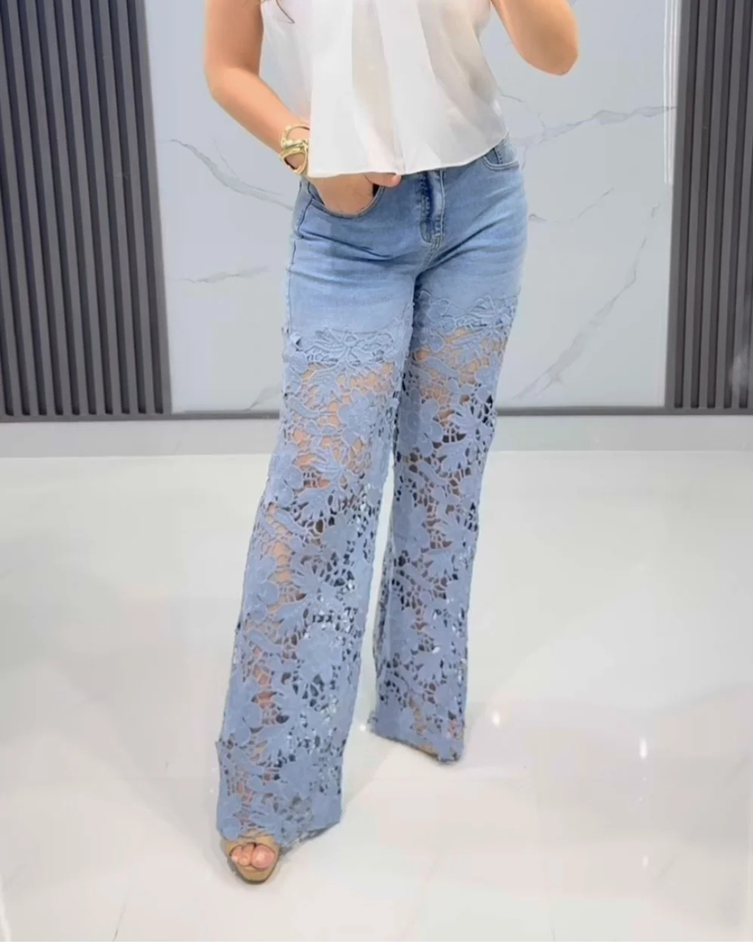 Women's jeans with floral lace on the legs